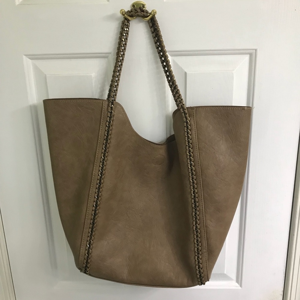 Brown/tan colored bag with brass metal detailing